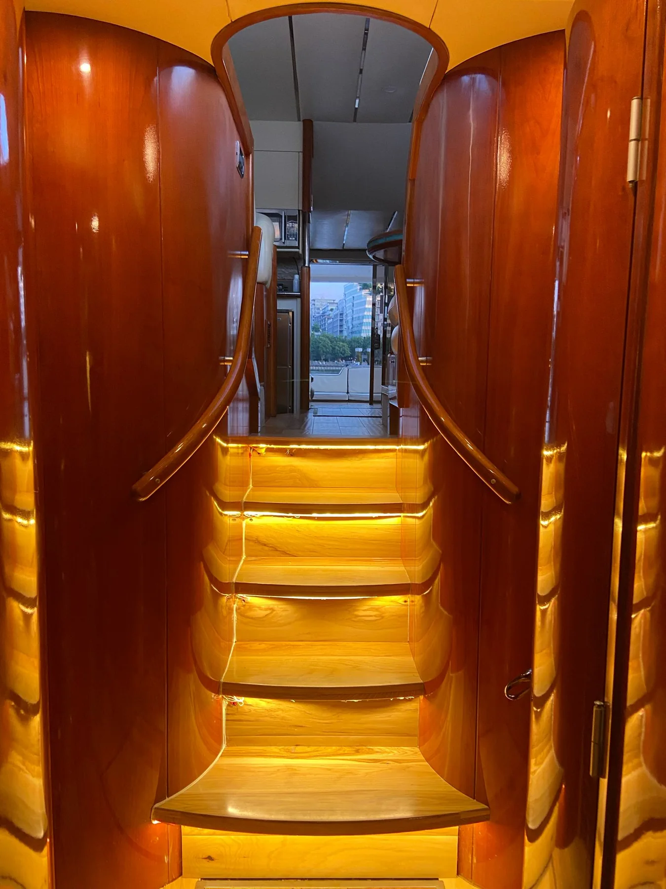 Illuminated interior staircase aboard the Fairline Celeste yacht