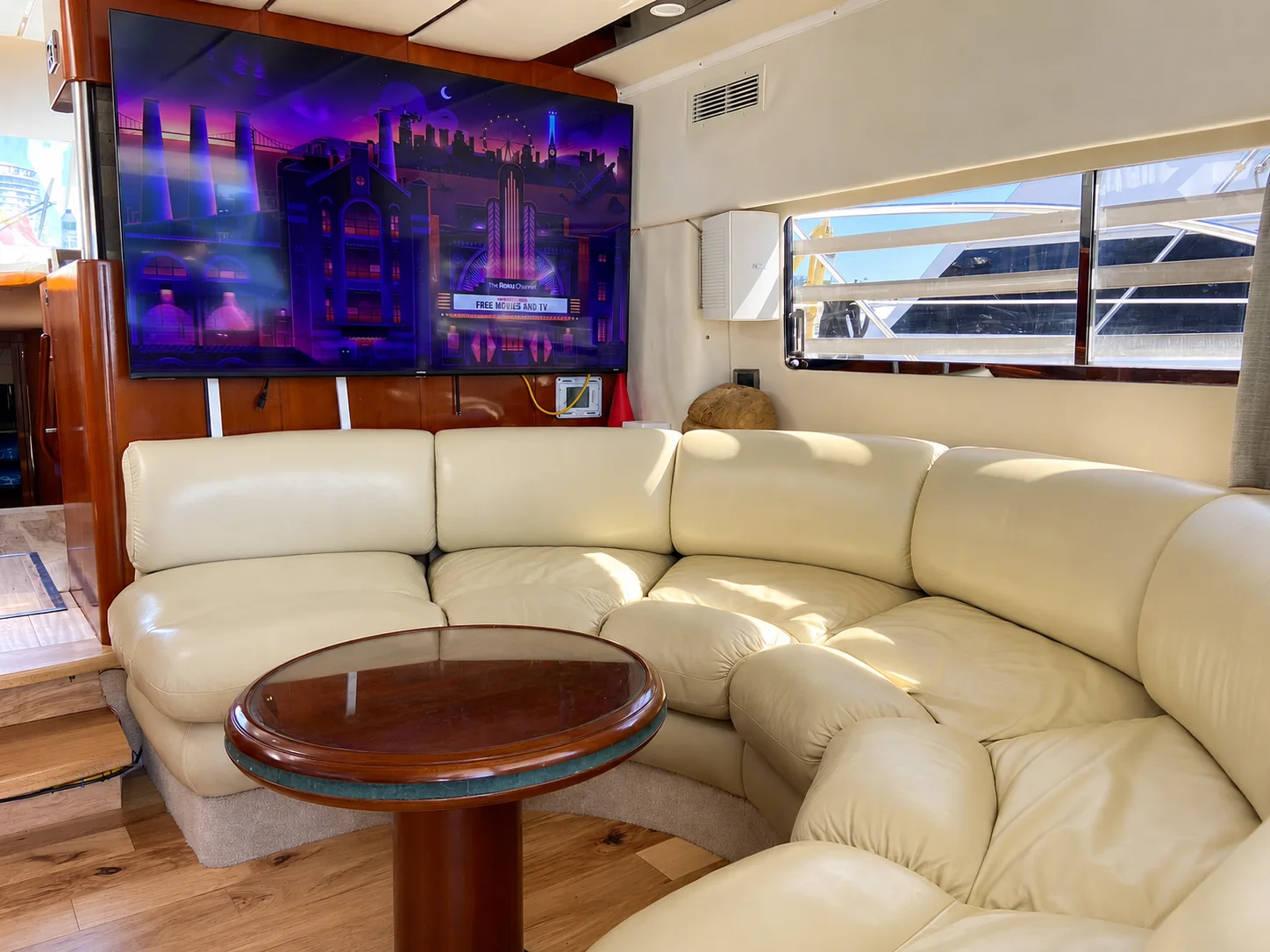 Television and sofa seating in the Fairline Celeste main salon