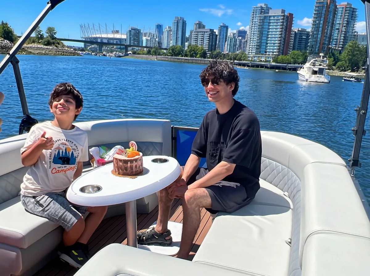 Kids birthday pontoon boat party with cake near Granville Island in Vancouver by SeaSky Cruises